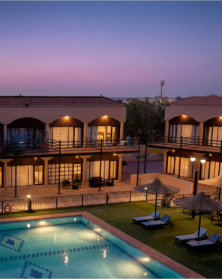 Residences around the pool at twilight